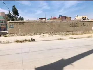 Walled corner land for sale, 300 m², Milli Township, behind new Interior Ministry