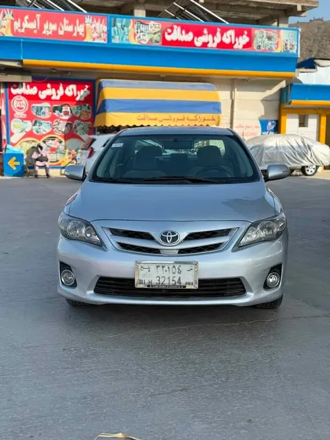 تویوتا کرولا ۲۰۰۹ ماډل ۲۰۱۳ سپینه نقره‌ای LE